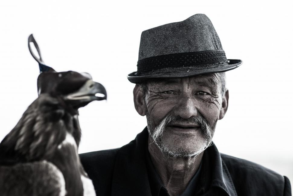 Free Image of Old Man in Hat with Eagle  