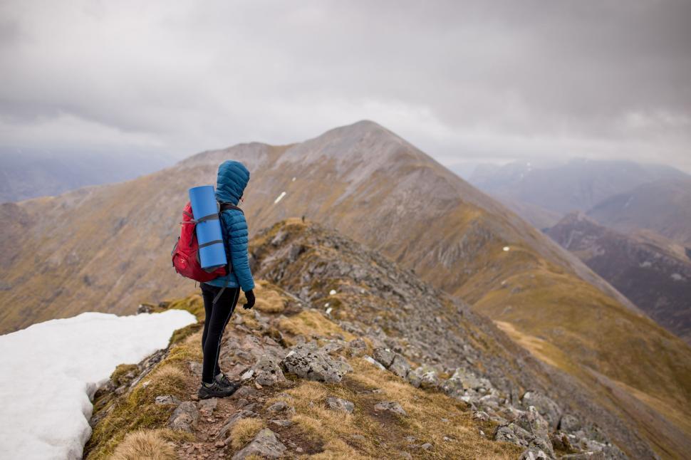 Free Image of Hiker on mountain peak  