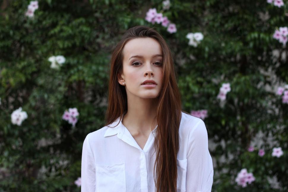 Free Image of Young Woman With Open Brown Hair - Eye Contact  