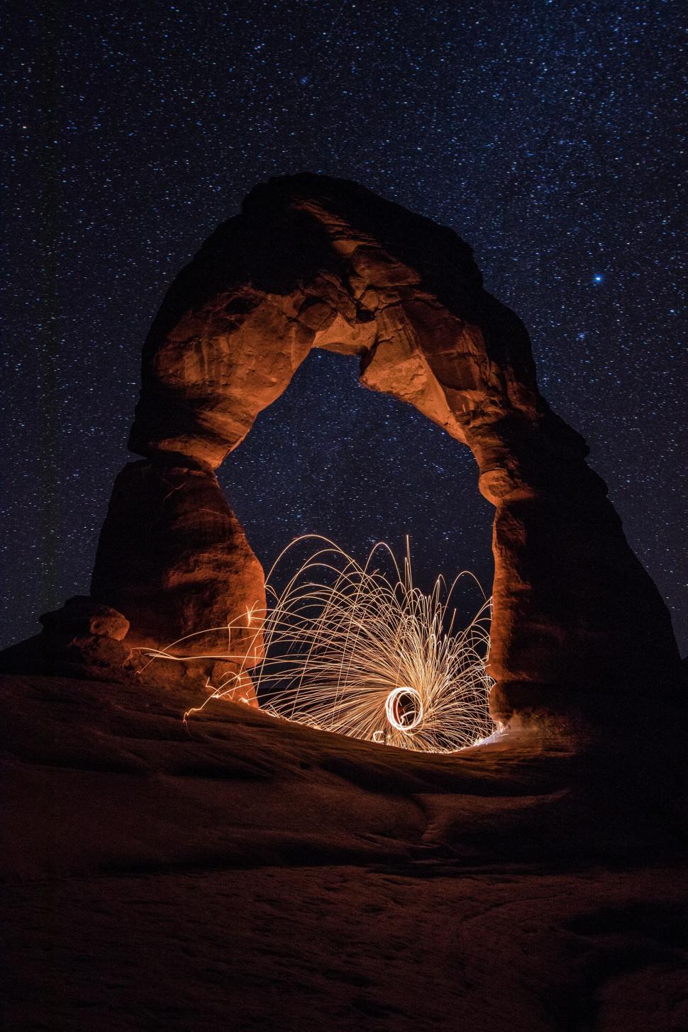 Free Image of Delicate Arch with Stars and Light Streaks  