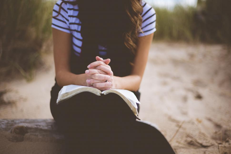 Free Image of Praying with Bible  
