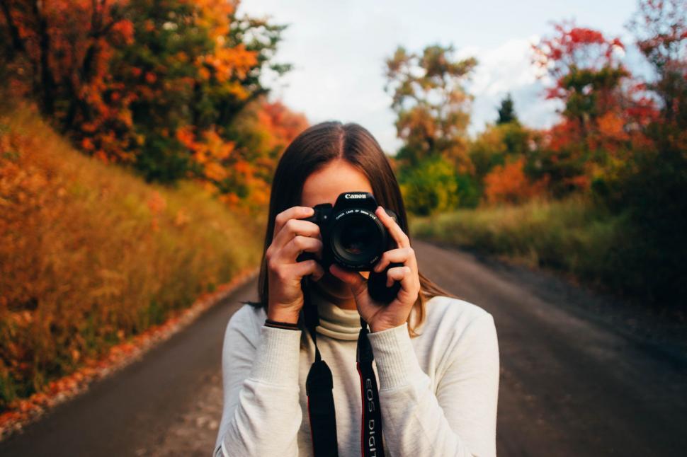 Free Image of Woman with Canon Camera  