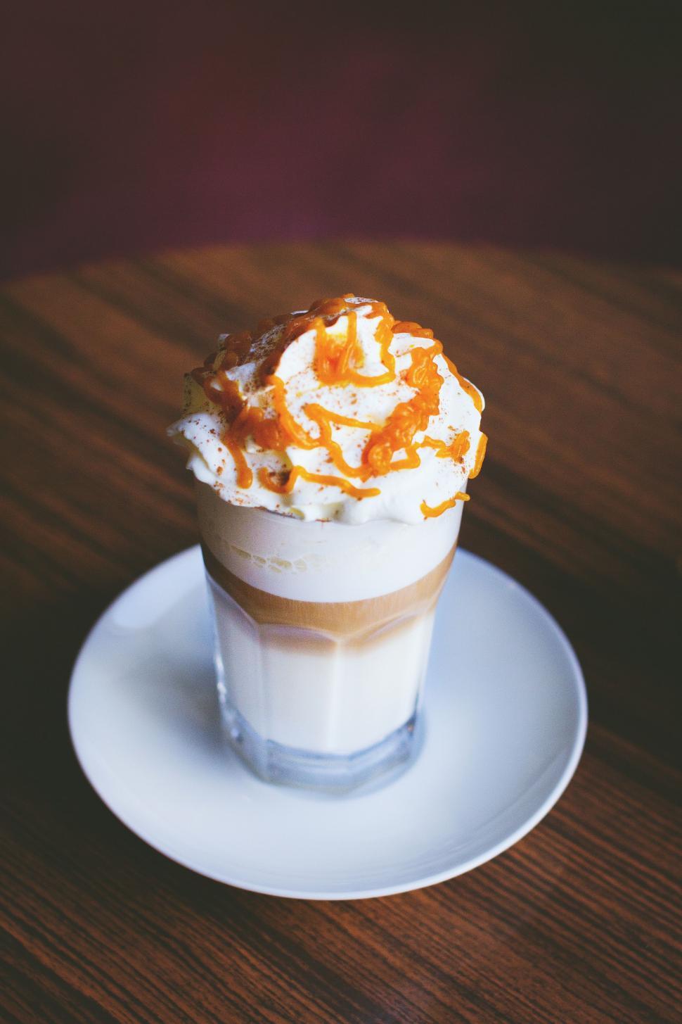 Free Image of Caramel milkshake on wooden table  