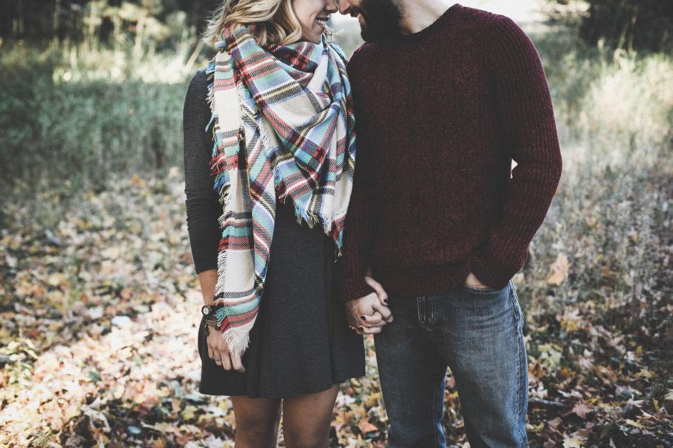 Free Image of Romantic Happy Couple Holding Hands 