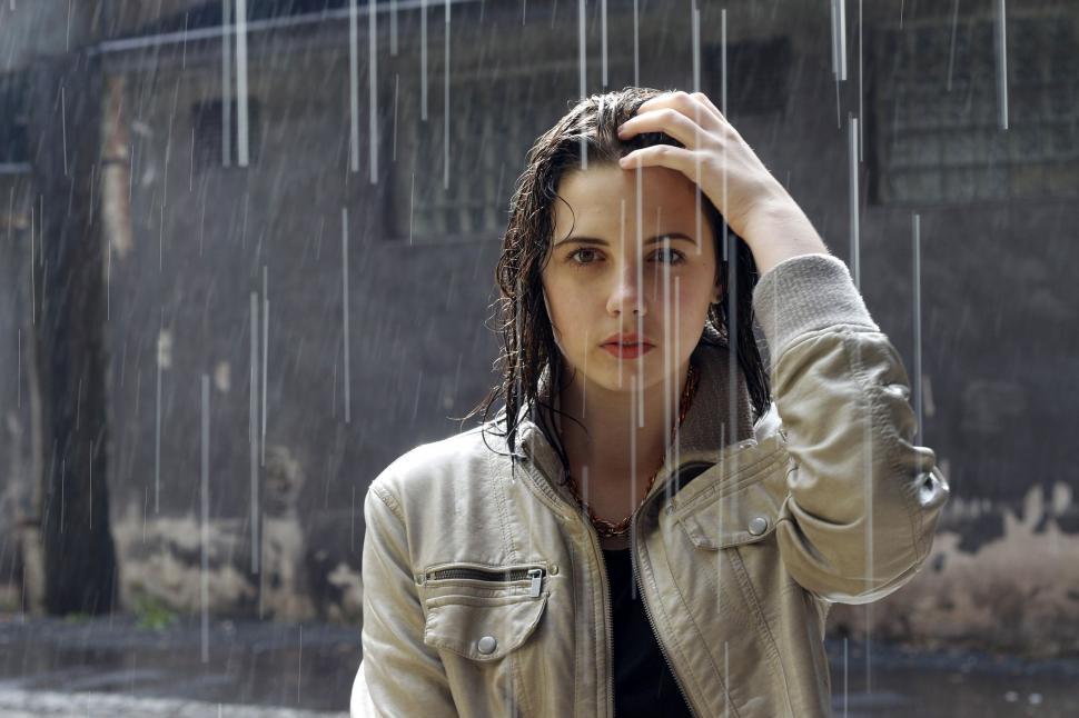 Free Image of Woman in rain - looking at camera  
