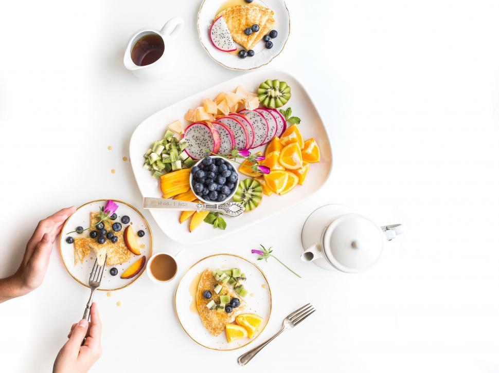 Free Image of Fruit Salad and Tea pot on white table  