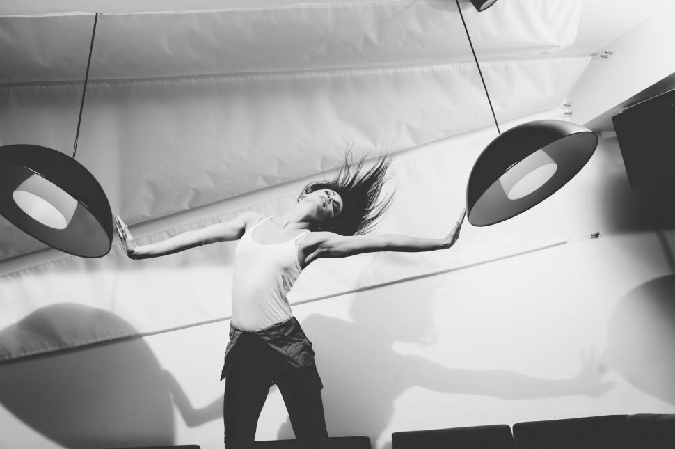 Free Image of Woman Hands on Hanging Lamps  