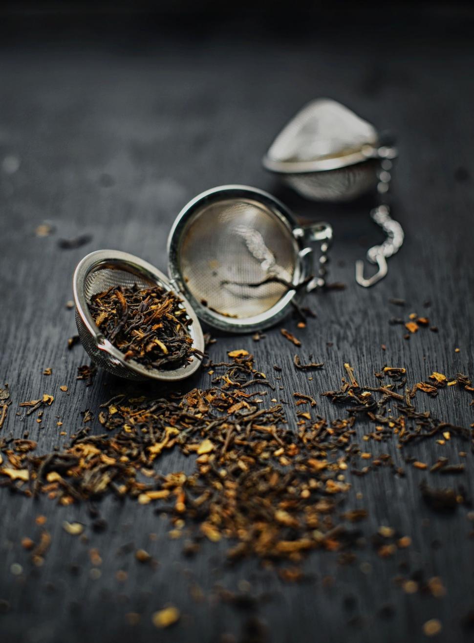 Free Image of Dried Tea Leaves on wooden table 