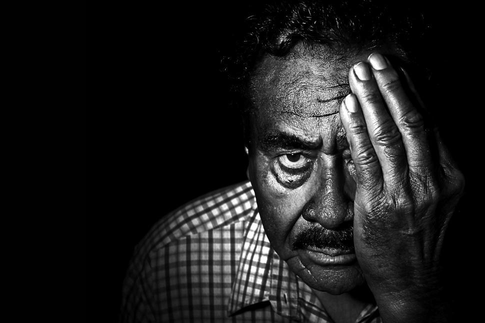 Free Image of Dark View of Elderly Man Face on black background  