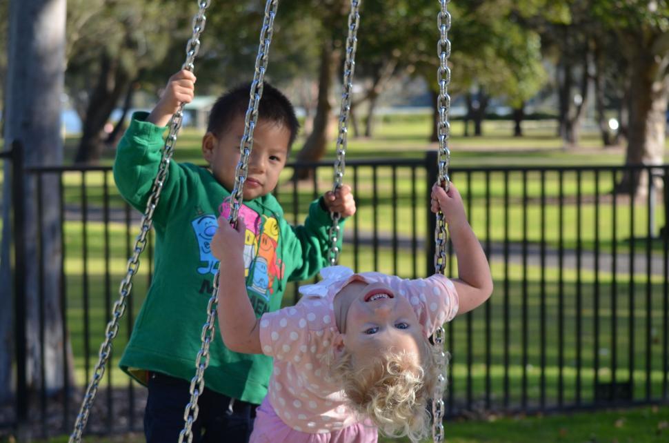 Free Image of Children Enjoying Swing Ride 