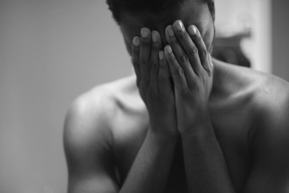Free Image of Man Hiding Face With Hands  