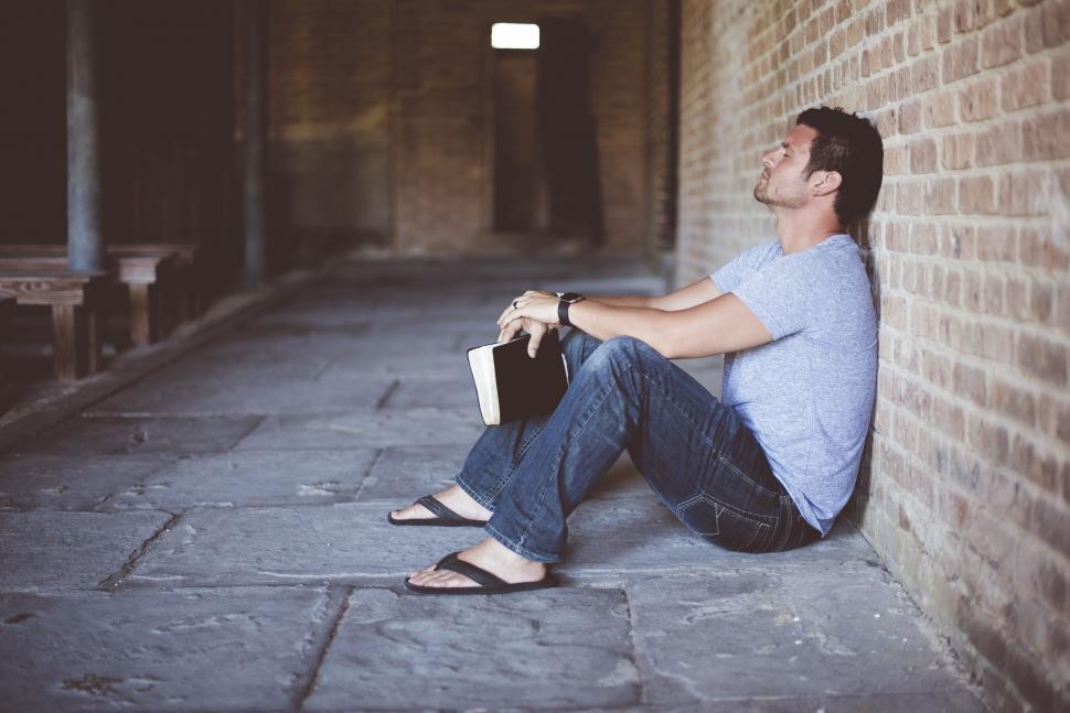 Free Image of Man Sitting With Bible  