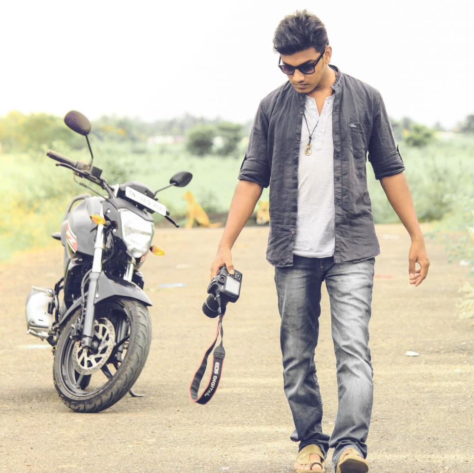 Free Image of Photographer with motorbike 