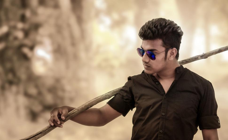 Free Image of Young Indian Man Posing in Sunglasses  