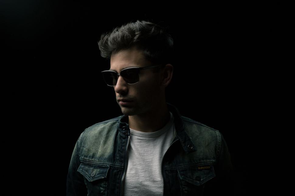 Free Image of Dark View of Male Fashion Model In Sunglasses  