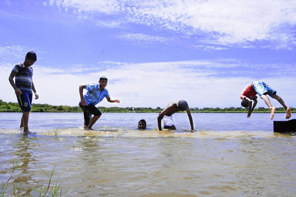 Free Image of Indian Men Bathing in Village River  