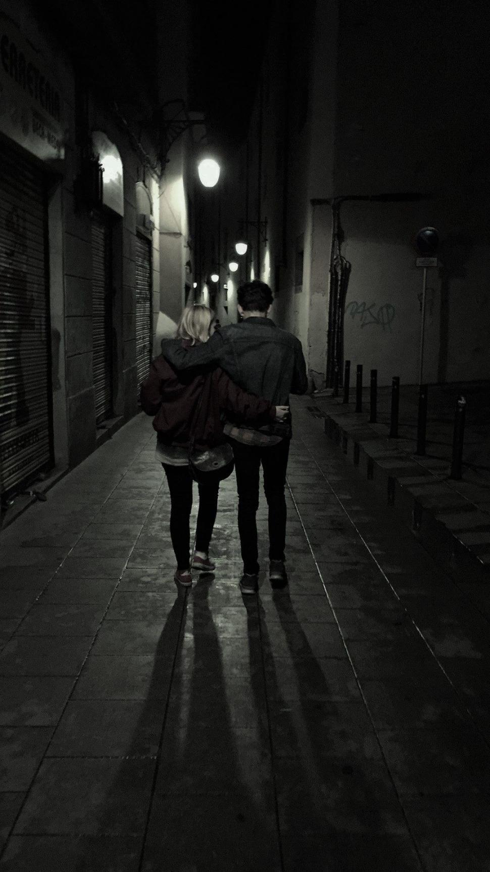 Free Image of Back view of couple in the alley  