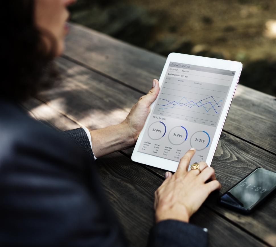 Free Image of Close up of a tablet device displaying business charts and graphs 