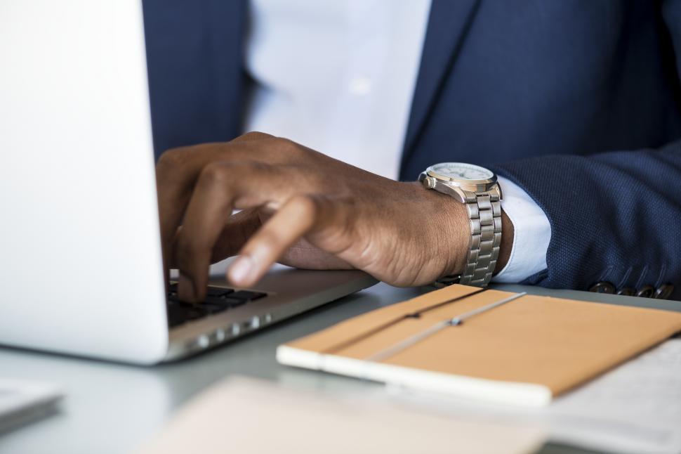 Free Image of Close up of a business person typing on the laptop 