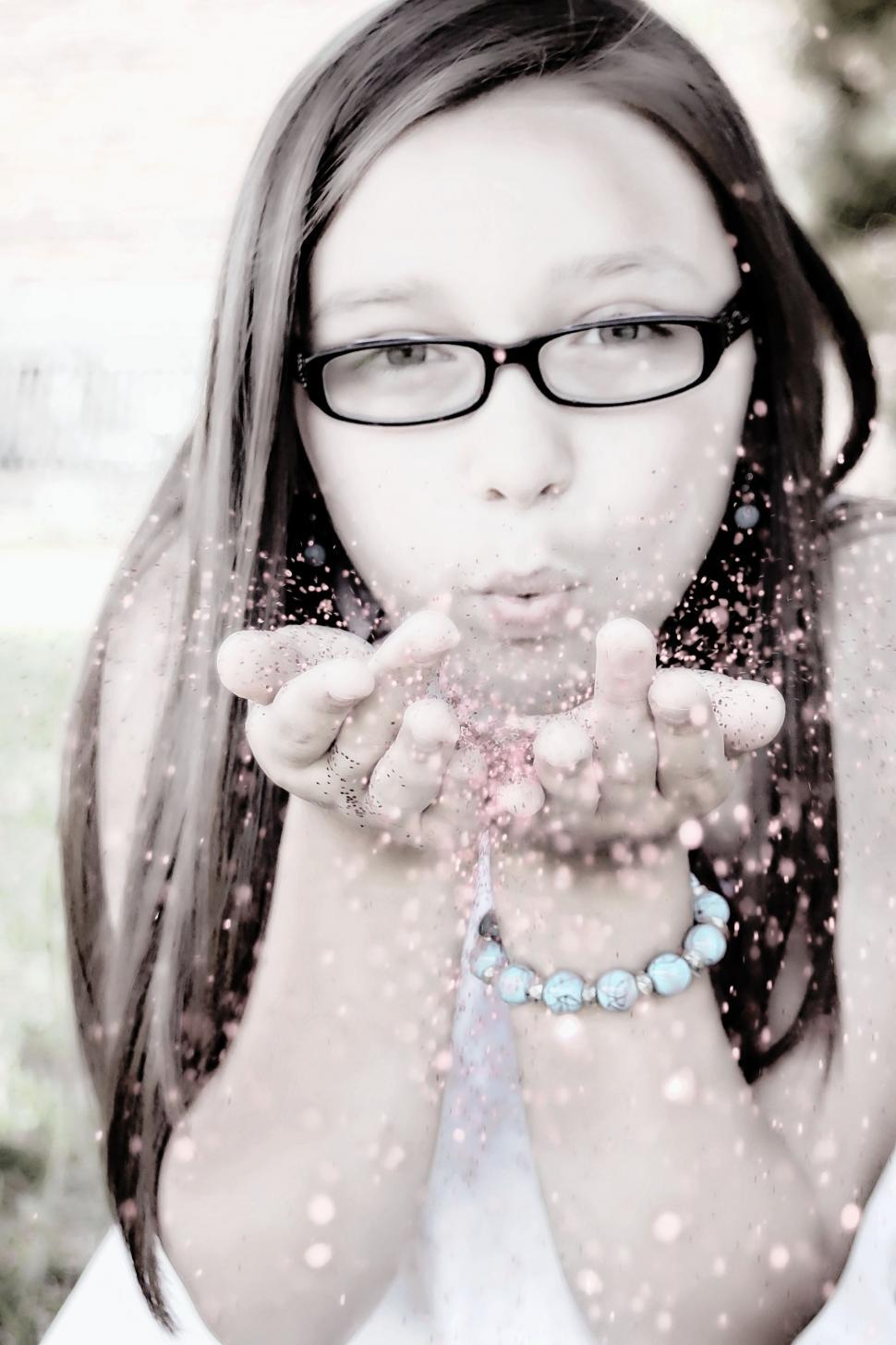 Free Image of Woman Blowing Glitter 
