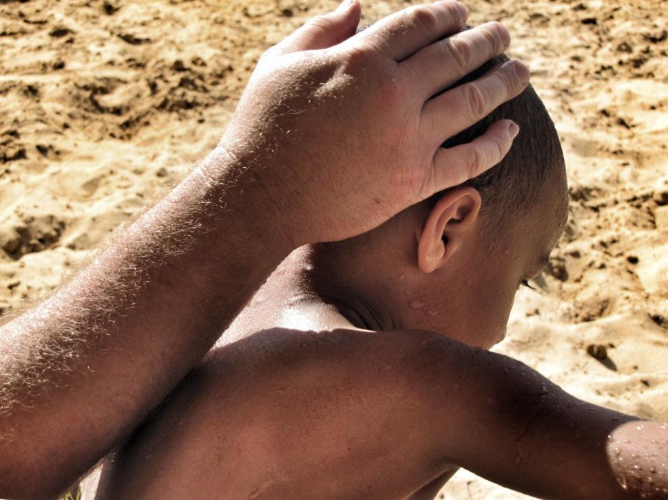Free Image of Back View of young father caresses son  