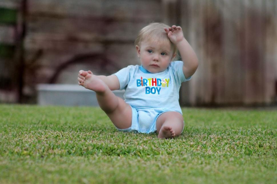 Free Image of Little Cute Boy in Grass Field  