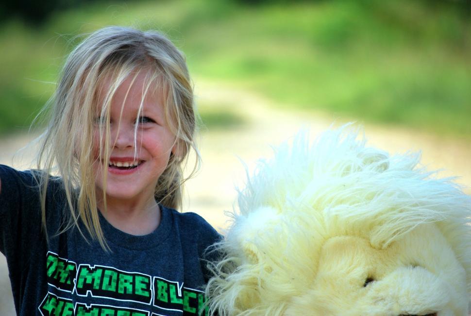 Free Image of Happy Little Girl With Teddy Bear  