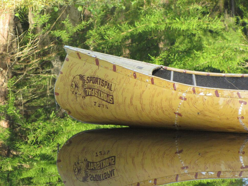 Free Image of Yellow Canoe and green plants  