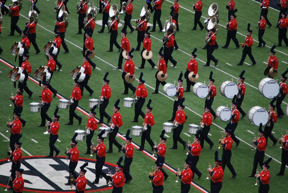 Free Image of Marching band members in red and black uniforms  