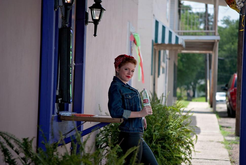 Free Image of Redhead Woman in Vintage Clothing With Coke Bottle 
