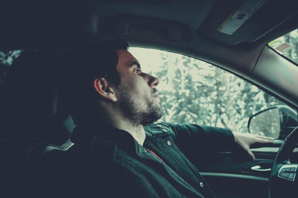 Free Image of Young man at driving seat - looking sad  