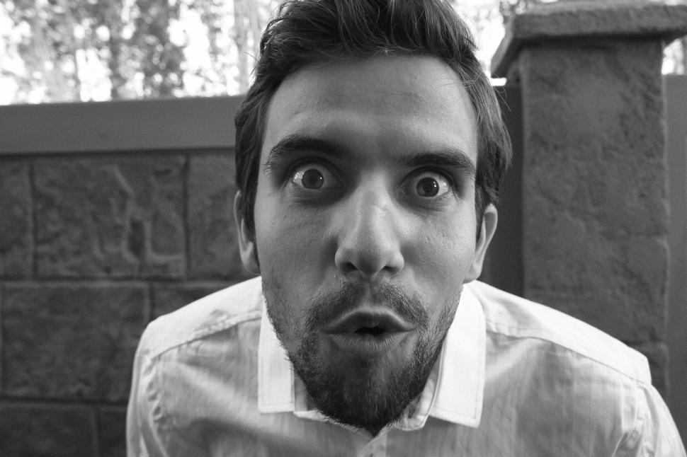 Free Image of Young man with surprise expression on his face 