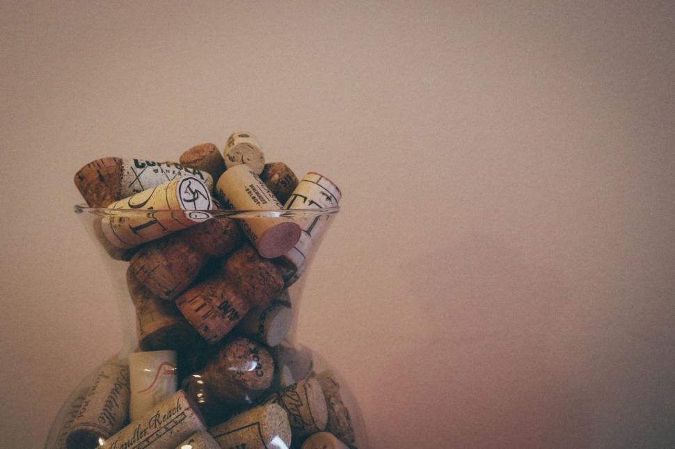 Free Image of Wine corks in glass vase  