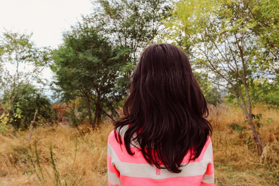 Free Image of Back view of young girl in forest  