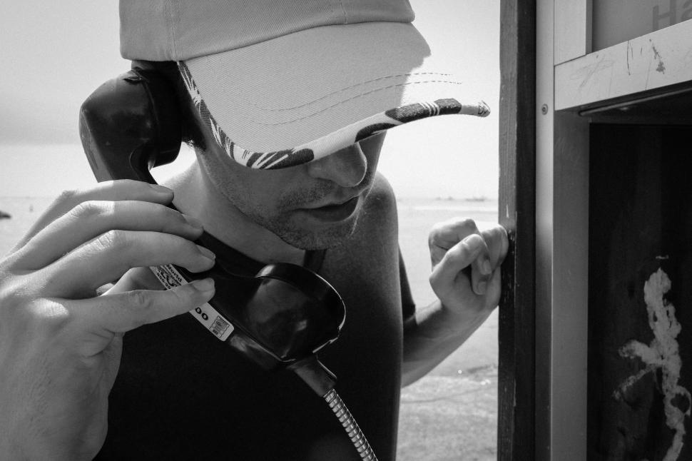 Free Image of Man and Payphone  