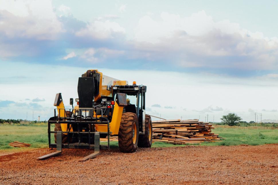 Free Image of Tractor and wood logs  