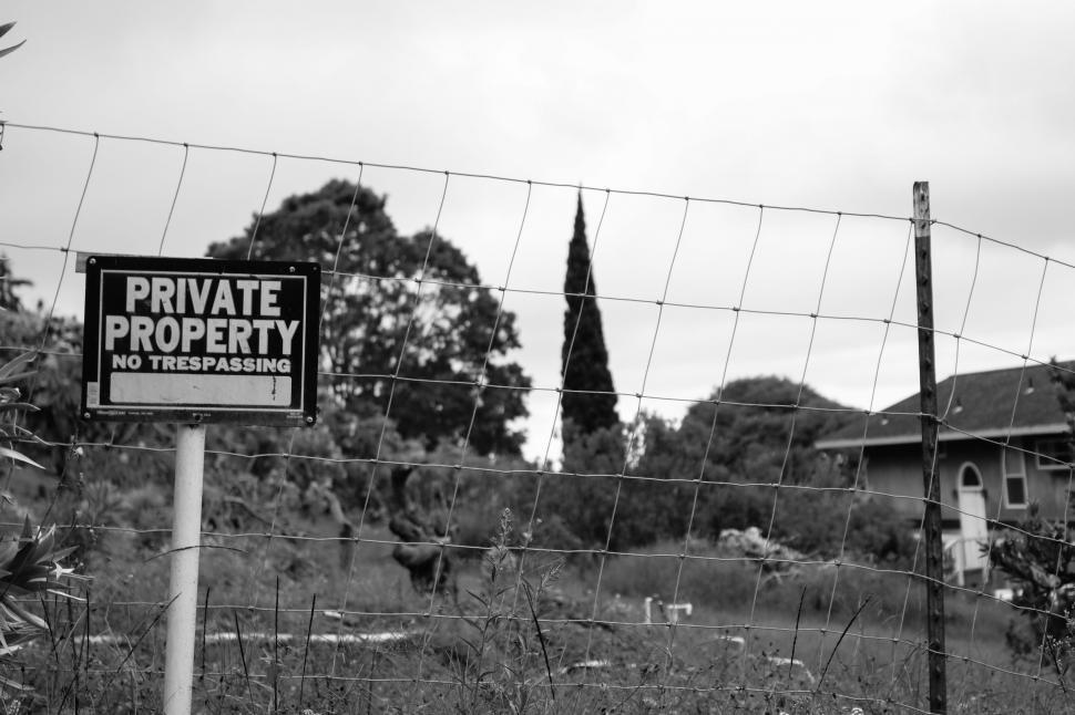 Free Image of No Trespassing Sign Board with wire fencing  