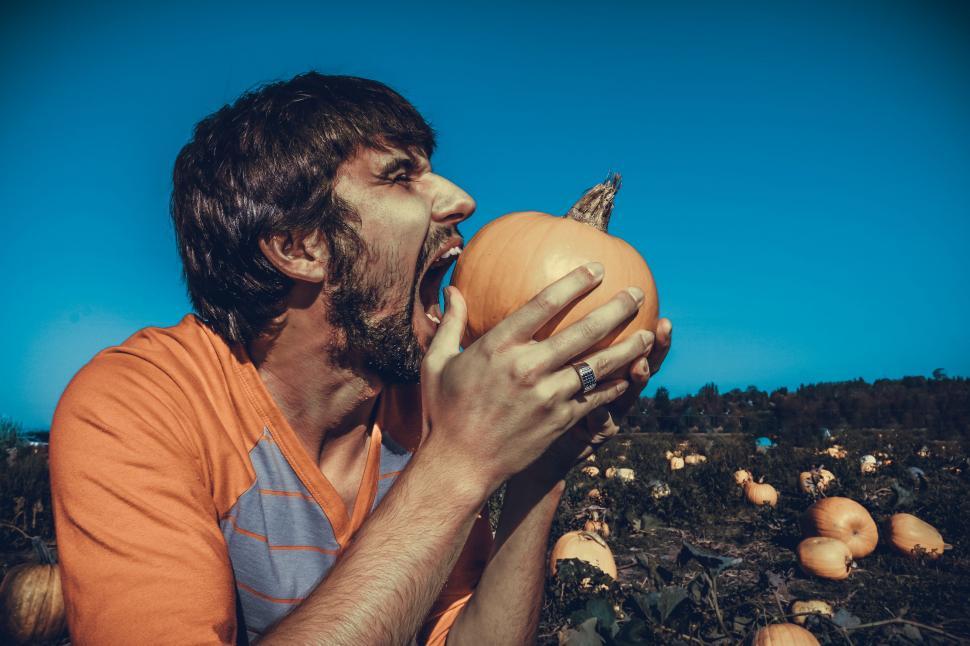 Free Image of Man With Open Mouth And Pumpkin 
