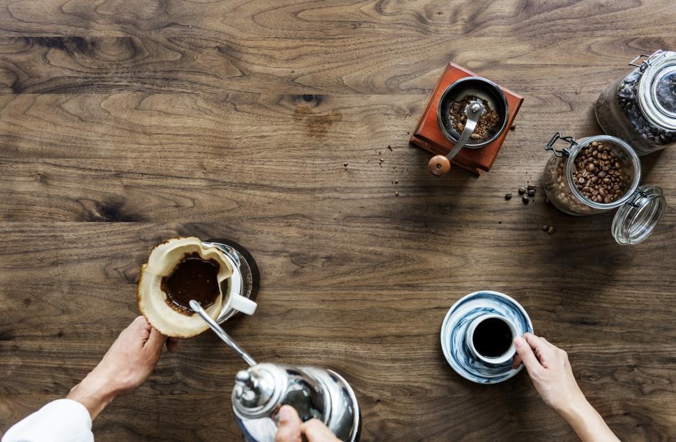 Free Image of Overhead background view of hot water being poured into a coffee filter cone 