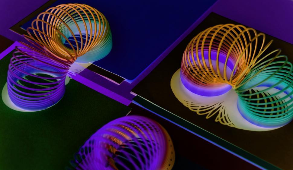 Free Image of Inverted color close up of colorful slinkys 