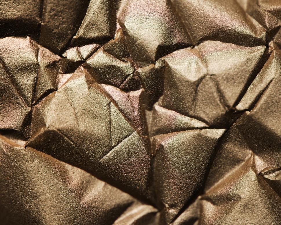Free Image of Abstract textured background of wrinkled golden paper 