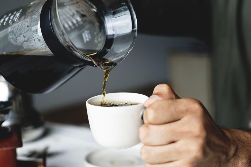 Free Image of Close up of drip coffee being poured into a cup 