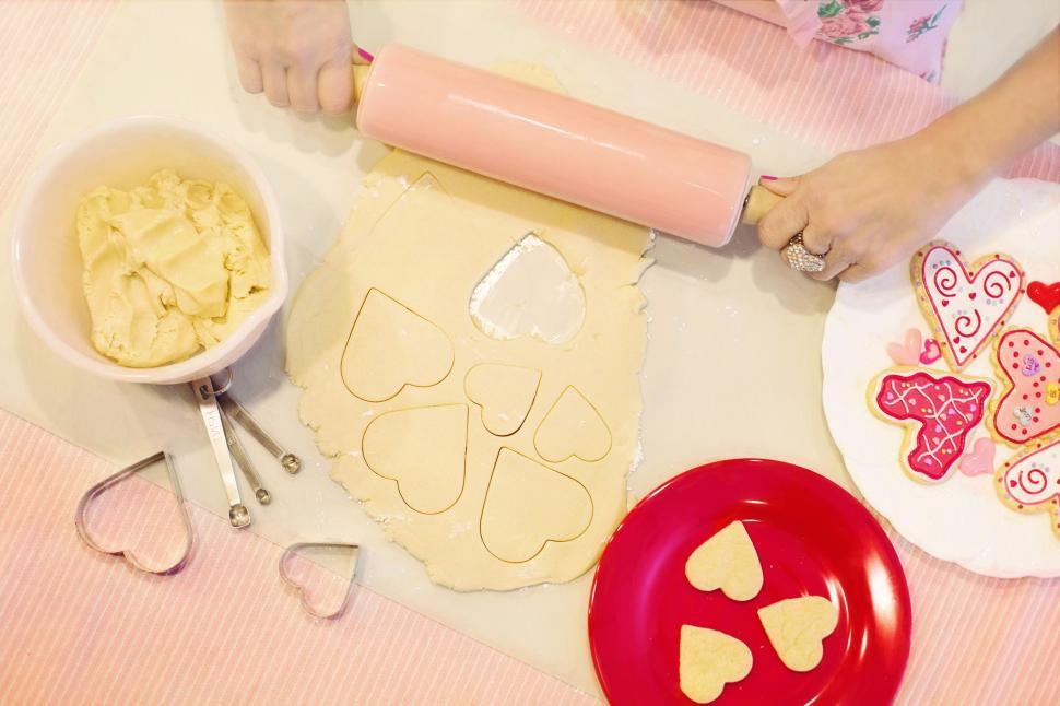 Free Image of Woman Hands and Heart shaped cookies 