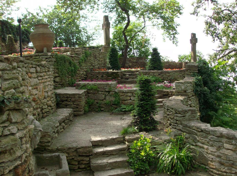 Free Image of Small garden with stone alleys full with flowers 