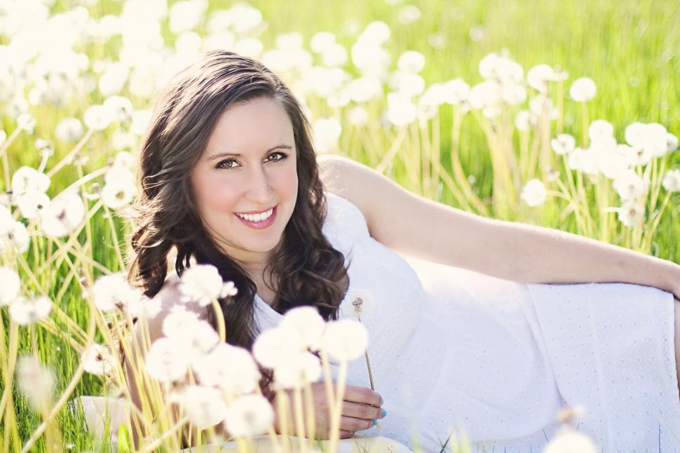 Free Image of Woman lying on flower field  