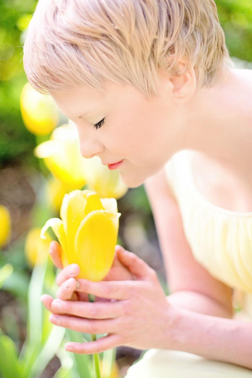 Free Image of Blonde Woman and Yellow Flower  