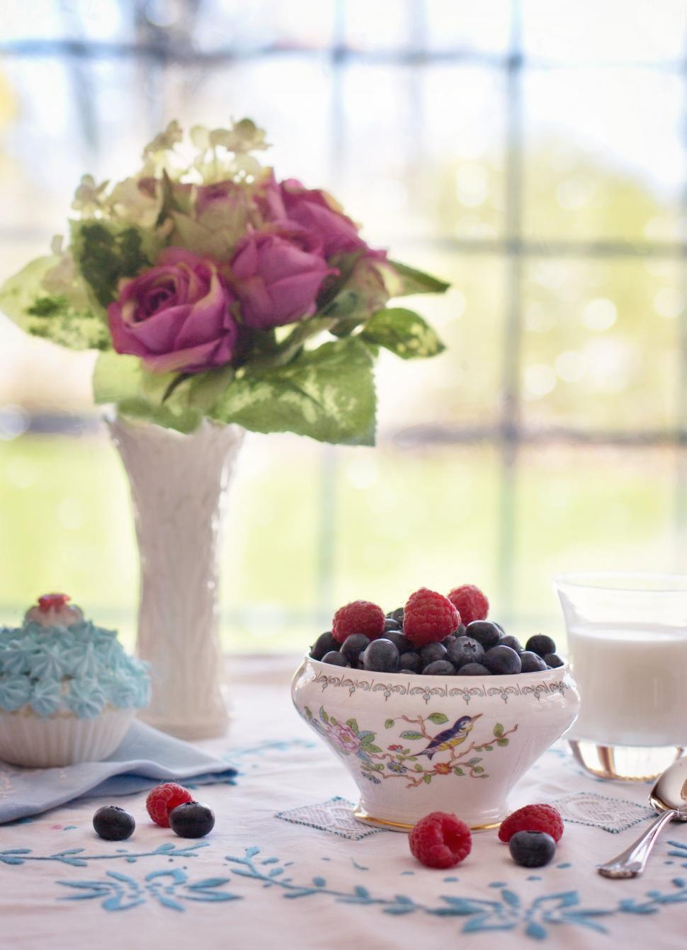 Free Image of Bowl of Blueberries and glass of milk  