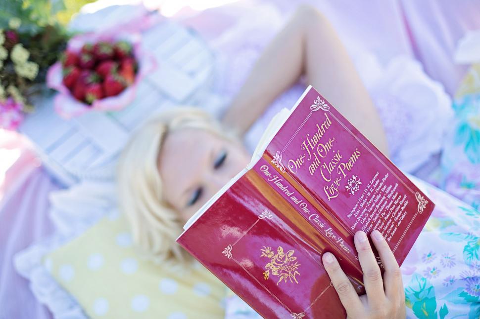 Free Image of Woman With Book During Picnic  