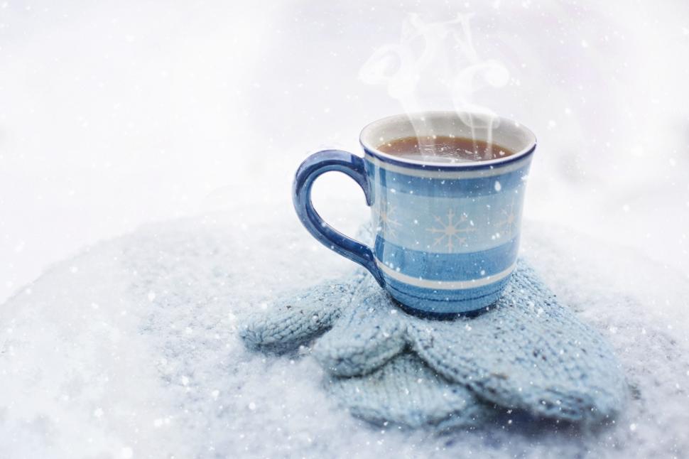 Free Image of Hot Coffee and Gloves in Snow 