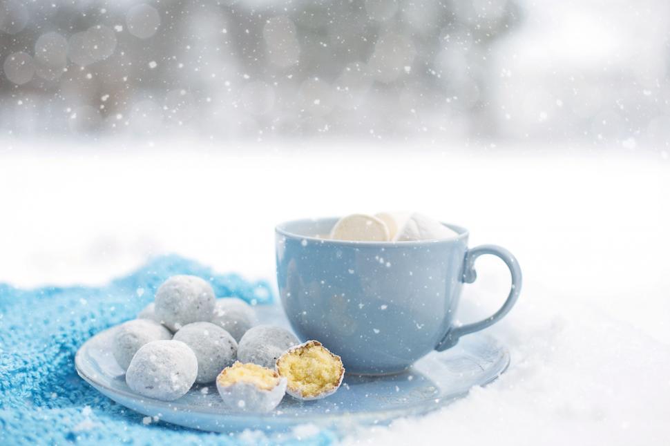 Free Image of Coffee and doughnut holes in snow  